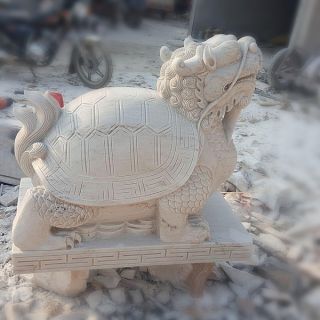 晚霞紅風水龍龜石雕是怎么制作出來的？